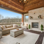 Laurel Pointe outdoor covered patio fireplace - Infinity Homes - Festival of Homes