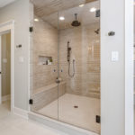Laurel Pointe primary bathroom large shower towel storage - Infinity Homes - Festival of Homes