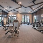 Traditions of America at Southpointe clubhouse fitness room - Festival of Homes